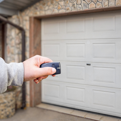 Chattanooga security key fob pointing to a garage door
